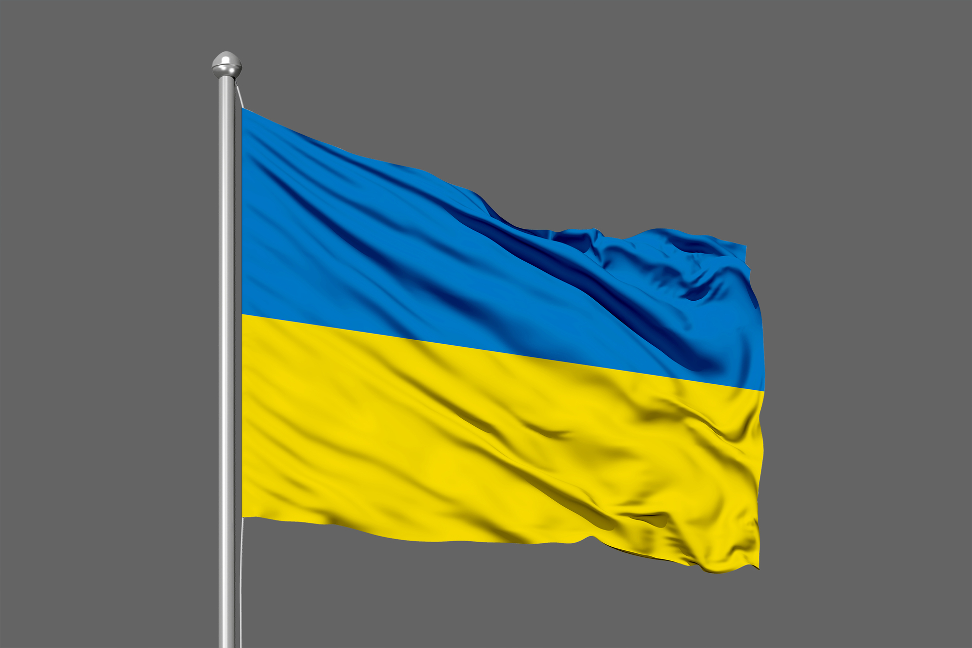 Flaga Ukrainy powiewająca na tle szarego nieba